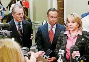  ?? [PHOTO BY PAUL HELLSTERN, THE OKLAHOMAN] ?? Treasurer Ken Miller, left, Secretary of Finance Preston Doerflinge­r and Gov. Mary Fallin speak to the media Tuesday after the Board of Equalizati­on meeting at the state Capitol.