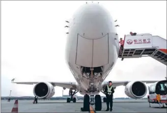  ?? XIE MINGGANG / FOR CHINA DAILY ?? An Airbus A350-900 plane arrives at Chengdu Shuangliu Internatio­nal Airport in Sichuan province.