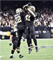  ?? AP Photo/Bill Feig ?? New Orleans Saints running back Alvin Kamara (41) celebrates his touchdown carry with running back Mark Ingram (22) in the second half against the Carolina Panthers on Sunday in New Orleans.