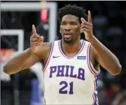  ?? JOHN RAOUX — THE ASSOCIATED PRESS ?? The 76ers’ Joel Embiid celebrates after making a shot and drawing a foul during the first half Thursday against the Magic in Orlando, Fla.