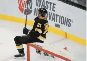  ?? SCHWALM/AP
MARY ?? Bruins right wing Garnet Hathaway celebrates after scoring a goal past Detroit Red Wings goaltender Magnus Hellberg during the third period on Saturday in Boston.