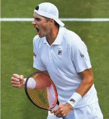  ?? Oli Scarff / AFP / Getty Images ?? John Isner’s only other Grand Slam quarterfin­al came in 2011 at the U.S. Open. On Friday, he’ll go for his first Slam final.