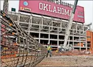  ?? SUE OGROCKI/AP ?? The University of Oklahoma has scaled back a renovation project to its football stadium amid slumping oil prices.