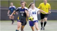  ?? STAFF PHOTO BY C.B. SCHMELTER ?? Chattanoog­a Christian’s Katie Davick and Boyd-Buchanan’s Ria Cox battle for possession at David Stanton Field on the campus of CCS on Thursday.