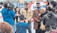  ?? COURTESY OF JOEL TANG ?? Jesse James, centre, in beige coat, at a prayer vigil Tuesday. He’s helping organize 25 days of song to honour the victims.