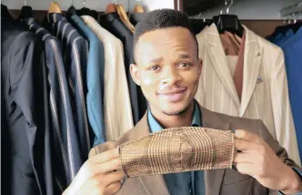  ?? | SHELLEY KJONSTAD ?? MLULEKI Qwabe, who is in the textile industry with his business The Modern Man Africa, shows the masks he has made to stay afloat during lockdown. ANA
