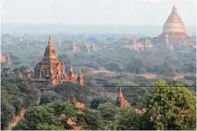  ??  ?? Tourists gather on a temple to watch the sunset. Most of the Buddhist temples, stupas and monuments in Bagan were built in the 11th and 12th centuries.