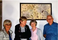  ??  ?? Below: Conservato­r Andrea Kirkham (second from left) with Friends of Hope Church and the “St Christophe­r” fragments