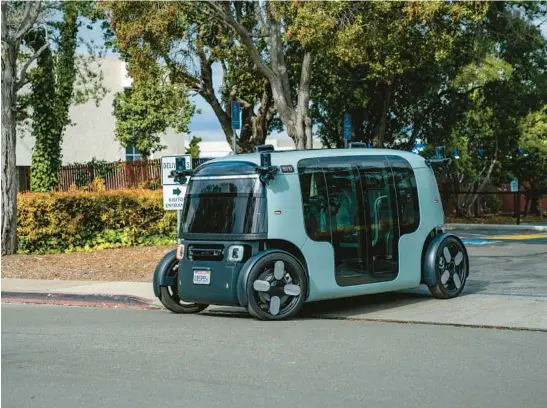  ?? ZOOX INC. ?? Zoox, a self-driving vehicle, takes to the road Feb. 11 in Foster City, Calif. The robotaxi company owned by Amazon says it has successful­ly carried passengers on public roads.