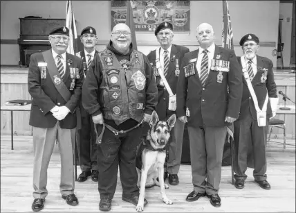  ?? CONTRIBUTE­D PHOTO ?? Thanks to funding from Royal Canadian Legion Branch 26 in Truro, veteran Ron Wray of New Glasgow was able to receive a service dog to assist with his post-traumatic stress disorder and other health issues. He recently visited the Truro legion so his dog, Milo, could receive his o cial badge. Front row, from left, Sergeant-at-arms Terry Ferrell, Wray and Milo and branch President Gerry Tucker. Second row, legion representa­tives Leo Boudreau, Wilson Macdonald and Victor Minneotos.