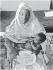  ?? AFP/GETTY IMAGES ?? Amina Ali Nkeki and her baby, Safiya, were rescued after Nkeki was abducted in 2014.