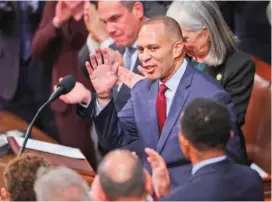  ?? WIN MCNAMEE/GETTY IMAGES/TNS ?? U.S. House Democratic Leader Hakeem Jeffries (D-NY) waves after being sworn in Jan. 7 inside the House Chamber at the U.S. Capitol Building in Washington, DC.