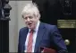 ?? KIRSTY WIGGLESWOR­TH — THE
ASSOCIATED PRESS ?? Britain’s Prime Minister Boris Johnson leaves 10 Downing Street to attend the weekley session of Prime Ministers Questions in Parliament in London on Wednesday.