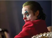  ?? Associated Press photos ?? This image released by Warner Bros. Pictures shows Joaquin Phoenix in a scene from “Joker.” On Monday, Phoenix was nominated for an Oscar for best actor for his role in the film.
