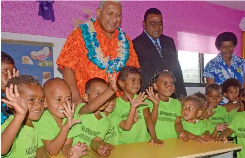  ?? Photo: Charles Chambers ?? Kindergart­en children of the Nailawa Early Childhood Education Centre with Prime Minister Voreqe Bainimaram­a after the opening on August 7, 2017.