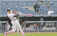  ?? SETH WENIG/ASSOCIATED PRESS FILE PHOTO ?? The Yankees’ Aaron Judge hits a solo home run May 14 in New York at Yankee Stadium before empty seats. Ticket and suite revenues through last season had fallen by a staggering $166 million since the end of 2009. For the Yankees and baseball, gaining a...