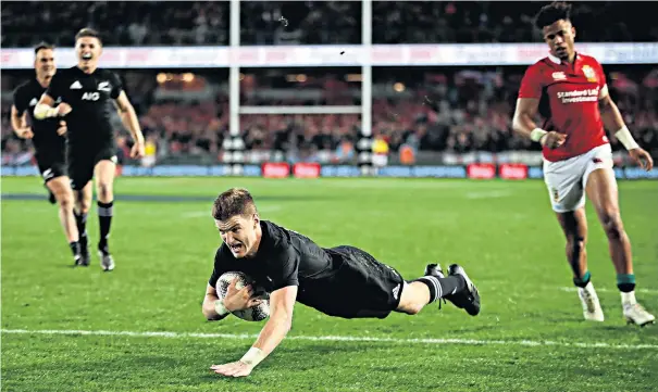  ??  ?? Over the line: Jordie Barrett scores New Zealand’s second try at Eden Park yesterday watched by Anthony Watson; his captain Kieran Read, however, admitted to ‘a hollow feeling’ after the All Blacks were held to a draw