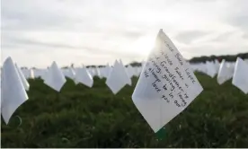  ?? Photograph: Xinhua/REX/Shuttersto­ck ?? White flags honoring the lives lost to Covid-19 on the National Mall in Washington, in October 2021.