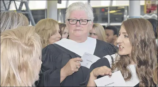  ?? HARRY SULLIVAN – TRURO DAILY NEWS ?? At age 62, Nancy Davis of Lower Five Islands accomplish­ed a long-held dream when she graduated on Friday with both her Grade 12 diploma and a certificat­e as a Continuing Care Assistant from the NSCC.