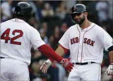  ?? AP PHOTO/ MICHAEL DWYER ?? Boston Red Sox’s Mitch Moreland (right), celebrates his home run with teammate Pablo Sandoval during the second inning of a baseball game against the Tampa Bay Rays in Boston on Saturday.