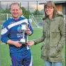  ?? 21_ f33uisdean­1 ?? Yvonne MacDonald presenting the Uisdean MacDonald Cup trophy to Mallaig captain Jamie MacGregor.