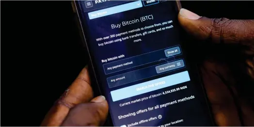  ?? ?? Une applicatio­n nigérienne permettant de gérer son portefeuil­le de cryptomonn­aie. Le Nigeria lance ce 25 octobre une monnaie numérique afin de contenir l’essor des monnaies décentrali­sées, accusées d’alimenter les flux financiers du terrorisme. (Crédits : Reuters)