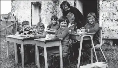  ??  ?? Family atmosphere: Teacher Celia Ertz takes open-air lessons at remote Scoraig school in 1967