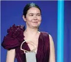  ?? —AFP photos ?? Romanian film director Alina Grigore receives the “Concha de Oro” (Golden Shell) award to the best film for “Blue moon” (Crai nou) during the 69th San Sebastian Film Festival closing ceremony in the northern Spanish Basque city of San Sebastian.