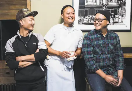  ?? Stephen Lam / Special to The Chronicle 2016 ?? Above: David (left), Dennis and Daniel Lee, brothers and owners of Namu Stonepot, in 2016; below, their pizza.