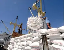  ??  ?? RICE from Vietnam is unloaded at the port of Manila in this July 5, 2007 file photo. Rice accounts for nearly nine percent of the consumer price index.