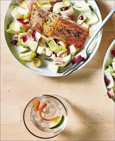  ?? PHOTOS BY STACY ZARIN GOLDBERG/ FOR THE WASHINGTON POST FOOD STYLINGS BY LISA CHERKASKY. ?? Honey Mustard Glazed Salmon With Endive and Green Apple Salad makes a light, high-protein dinner.