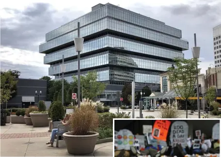  ?? GETTY IMAGES FILE ?? SETTLING UP: The headquarte­rs of Purdue Pharma is seen in Stamford, Conn. The company that makes OxyContin will advertise how to make a claim against the company. At right, pill bottles representi­ng Oxy prescripti­ons are seen at a protest in Washington.