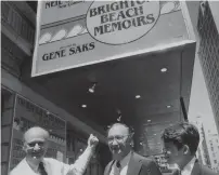  ?? AP ?? Mayor Ed Koch (left) points to the new marquee which renames the Alvin Theater to Neil Simon Theater as he is joined by playwright Neil Simon (centre) and actor Matthew Broderick in New York in this June 29, 1983, photo. —