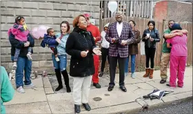  ?? TOM KELLY III – DIGITAL FIRST MEDIA ?? Tracey Lawson prays as The Rev. Dr. Vernon Ross sings “Amazing Grace” during a vigil for Pottstown homicide victim Siani Overby in the 300 block of Johnson Street in April 2018. At left are Siani’s two children who Lawson, Siani’s mother, says she will raise.