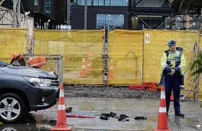  ?? PHOTO: RNZ ?? Police at the scene of an incident in which five people were injured in an explosion at a constructi­on site in the Wynyard Quarter on Auckland’s viaduct last week.