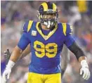  ?? MARK J. TERRILL/AP ?? Rams defensive tackle Aaron Donald, celebratin­g a sack against the Bears, has eight sacks on the season.