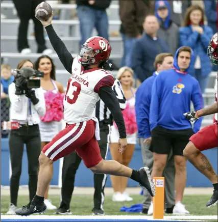  ?? Ian Maule Tulsa World via AP ?? Oklahoma quarterbac­k Caleb Williams runs the ball in for a touchdown against Kansas during the Sooners’ 35-23 victory over the Jayhawks on Saturday in Lawrence, Kan.