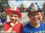  ?? PAUL POST — PPOST@ DIGITALFIR­STMEDIA.COM ?? Bodhi Updike, 3, of Ballston Lake and Zack Goodwin, 10, of Saratoga Springs, left to right, donned plastic firefighte­r helmets at Big Truck Day festivitie­s on Saturday. )