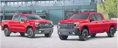  ?? —CHEVROLET ?? 2019 Chevrolet Silverado Trail Boss, left, with the fullsized Lego Silverado, right.