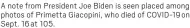  ?? ?? A note from President Joe Biden is seen placed among photos of Primetta Giacopini, who died of COVID-19 on Sept. 16 at 105.