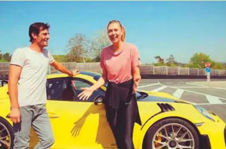  ?? Maria Sharapova’s Instagram ?? ■ Maria Sharapova with Mark Webber interact during a photoshoot in Germany. The five-time Grand Slam winner tried her hand on a factory-fresh 700-horsepower Porsche 911 RT2 RS around a test track.