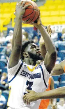 ?? PHOTO BY BRYANT HAWKINS ?? University of Tennessee Chattanoog­a’s David Jean-Baptiste takes a shot against UT Martin in a 2017 game at McKenzie Arena. Jean-Baptiste will play with the Haitian national team this summer in the Caribbean Cup.