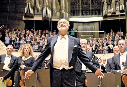  ??  ?? Maestro: the German conductor Kurt Masur with the Leipzig Gewandhaus Orchestra in 2001, above; Johannes Brahms (seated, far right) in 1896, below