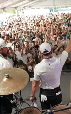  ?? ?? Rocking it: Rory McIlroy warms the crowd up