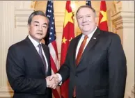  ?? WANG YING / XINHUA ?? State Councilor and Foreign Minister Wang Yi and US Secretary of State Mike Pompeo meet in Washington on Wednesday.