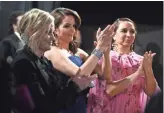  ?? MATT PETIT/AMPAS VIA USA TODAY NETWORK ?? Before Amy Poehler, left, Tina Fey and Maya Rudolph presented supporting actress (to Regina King of "If Beale Street Could Talk"), they huddled over an iPad to practice their lines.