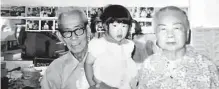  ?? Courtesy Bo Jo Lim ?? Bo Jo Lim grew up at the Golden Star Cafe. Here, she’s with Koon Yen Lim, her grandfathe­r, and Nui Lee Wong Lim, her grandmothe­r, in the early 1970s.