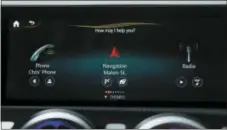  ?? BEHIND THE WHEEL-PERSONAL ASSISTANTS VIA AP ?? This undated image provided by Mercedes shows the MBUX system in use. The system provides many time-saving convenienc­es of voice command and personal assistant functions while you’re on the road.