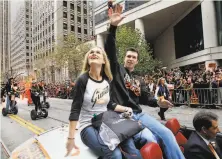  ?? Brant Ward / The Chronicle 2012 ?? Buster Posey and his wife, Kristen, shown celebratin­g a World Series victory in 2012, are adoptive parents to newborn twins.