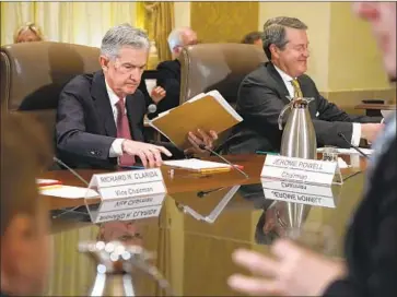  ?? Jacquelyn Martin Associated Press ?? FED CHAIRMAN Jerome H. Powell, left, and Randal Quarles voted to limit banking’s strictest rules.